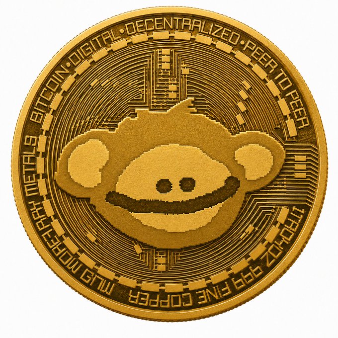 A gold coin engraved with the Reddit Snoo mascot logo, surrounded by text reading "BITCOIN DIGITAL DECENTRALIZED PEER TO PEER", "MJB METALS", "999 FINE COPPER", and "TROY OZ"