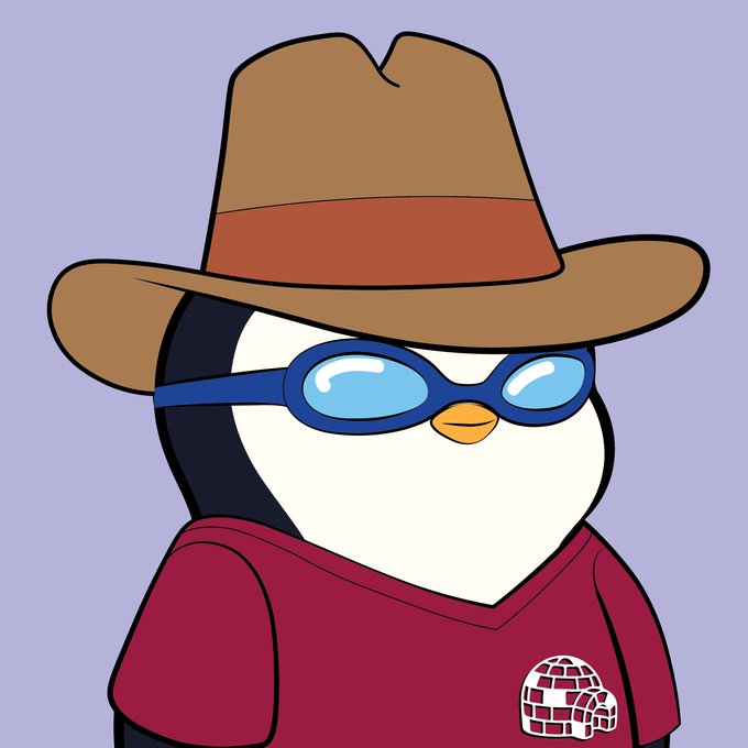 urn-shaped headband with a polar bear design, red shirt, and brown cowboy hat.
