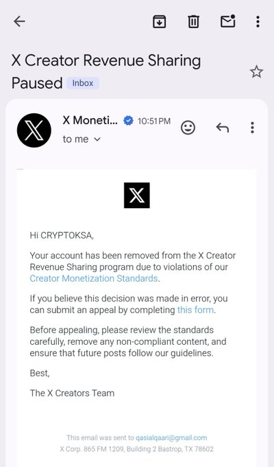 An email announcing that the "X Creator Revenue Sharing" for account "CRYPTOKSA" has been paused due to violations of creator monetization standards. This likely relates to the post's sentiment that the user is being cheated by "crumbs" of value.