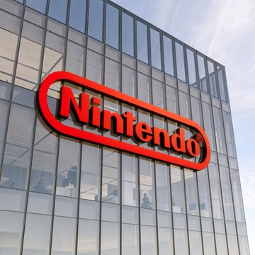 The image displays a glass-fronted office building featuring a prominent red Nintendo logo mounted on its facade. The image serves as a visual reference to the company mentioned in the post, which notes that Michael Saylor's Strategy has surpassed video game giant Nintendo in market cap, attributed to the "#Bitcoin Effect."
