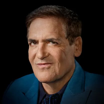 A portrait of Mark Cuban, the billionaire entrepreneur and television personality, shown smiling confidently against a dark background while wearing a blue suit. The image accompanies an article about his prediction that computer chips will become the next major investment trend, comparing them to cryptocurrency.