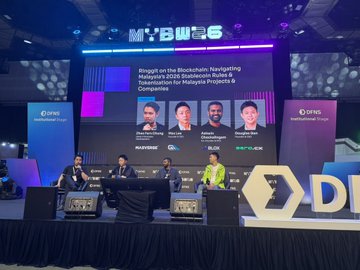 A panel discussion at TOKEN2049 Singapore featuring speakers discussing "Settlement for Malaysia's NodeAI Decentralized," with the screen displaying moderators including Matt from Aethir and Cheng, alongside panelists from Bitrue, ChainGPT, and OKX. A woman in a yellow jacket sits on the panel, fitting the post's reference to wearing "the same jacket" while joining SERA Protocol's green-chain initiative in Singapore.