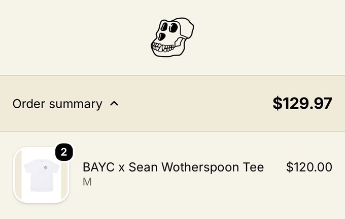 Order summary screen showing a $129.97 total, featuring a BAYC x Sean Wotherspoon Tee (size M) priced at $120.00, with a Bored Ape skull logo above.