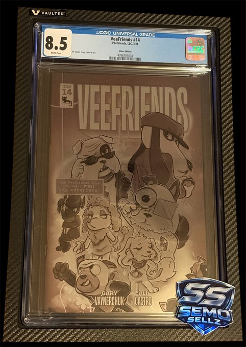 A CGC graded 'Veefriends #14' comic book slab is encased in plastic, receiving an 8.5 grade, with cover art by Gary Vaynerchuk and art by Alli Castro, featuring characters in black and white illustration.