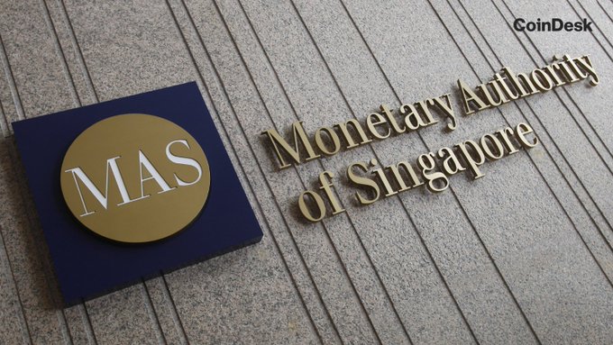 The image shows the Monetary Authority of Singapore (MAS) logo and signage mounted on a stone building facade. The CoinDesk watermark appears in the upper right corner, and the image relates to the post by illustrating the Singapore financial regulator that is proposing stricter, legally binding stablecoin regulations.