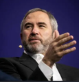 Ray Dalio, founder of Bridgewater Associates, is shown speaking and gesturing with his hand, likely at a financial conference or interview. His appearance accompanies a post discussing crypto trading strategies involving Ripple, contrasting institutional value-based decisions against retail speculation on Bitcoin and Ethereum.