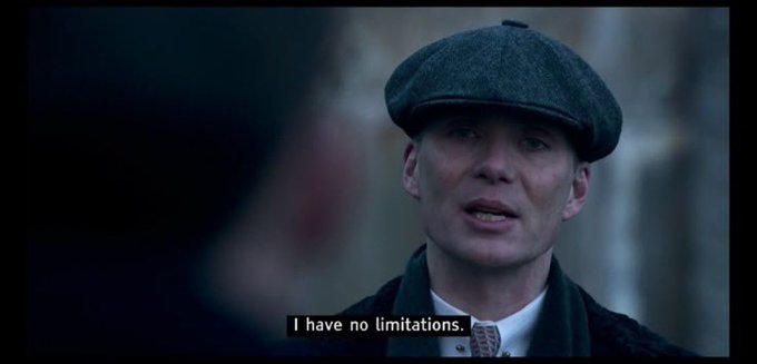 A movie still shows actor Cillian Murphy in a flat cap and dark coat, with the subtitle reading 'I have no limitations.'