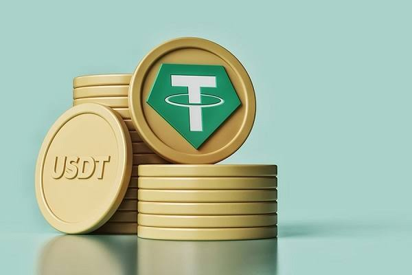 A stack of gold USDT coins is displayed, with one coin prominently featuring the green Tether (T) logo against a soft teal background. The image visually reinforces the article's focus on TRON's significant role in processing billions of dollars in daily USDT transactions.