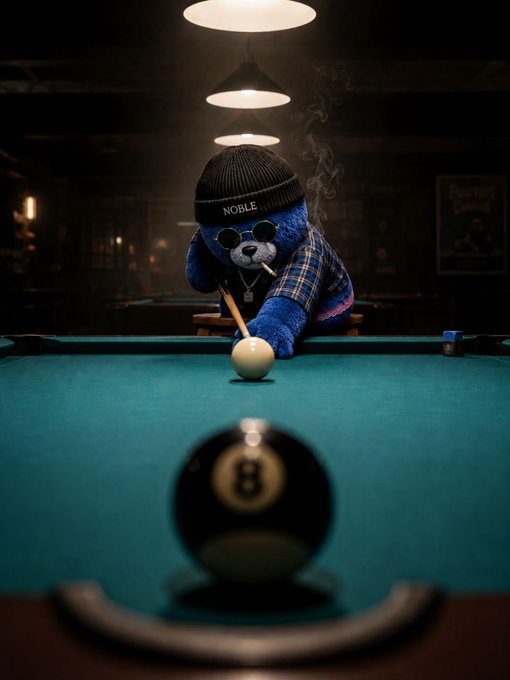 A blue teddy bear wearing sunglasses, a plaid shirt, and a beanie labeled 'NOBLE' smokes a cigarette while lining up a billiards shot on a green pool table.