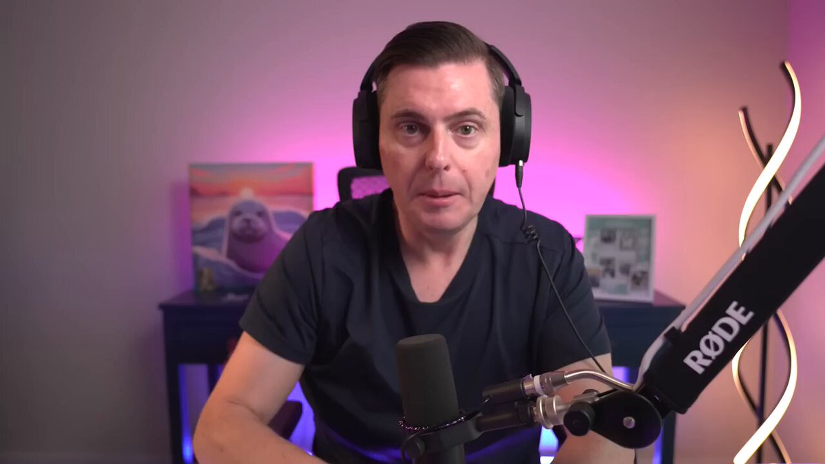 The image shows a man wearing headphones sitting at a desk with a microphone, possibly participating in an online radio show or podcast. The background features a painting of a bird, adding artistic flair to the scene. The text "XRP could be entering a new category Ripple recently asked regulators to treat XRP more like Bitcoin and Ethereum under certain regulatory frameworks" suggests that Ripple is exploring new ways to categorize and regulate digital assets. This may involve treating XRP as a form of cryptocurrency or even a token, similar to how Bitcoin and Ethereum are currently treated in the financial world.