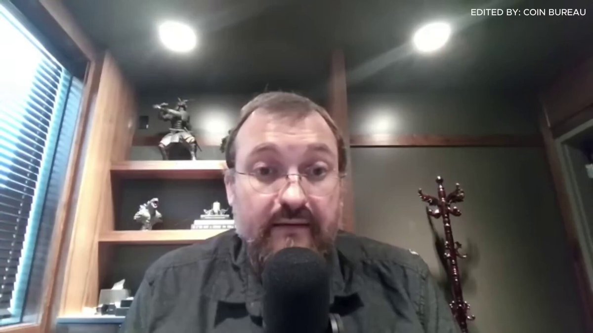 The image shows a man wearing glasses sitting at a desk with a microphone, suggesting that he might be hosting a podcast or recording an interview. The man appears to be talking about a failed project called "Cardano," which has been described as a "dead and failed project." This project was worth millions of dollars when it launched in 2013 but ended up being worth only a few cents due to its failure. The post also mentions that the founder of Cardano, Charles Hoskinson, is sitting in the toilets.