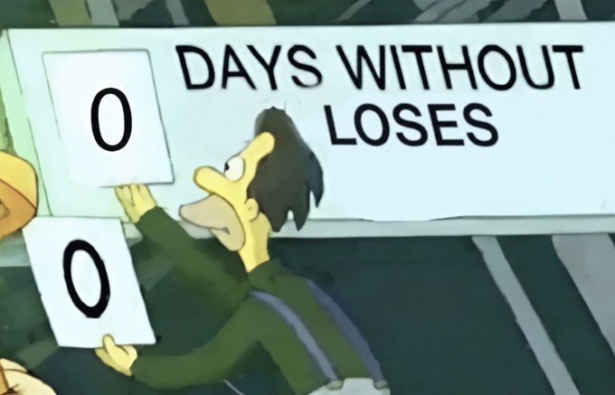 An animated character holds up two signs reading "0" beneath a banner that says "DAYS WITHOUT LOSES," humorously illustrating the "Real" sentiment by showing that some days (or streaks) simply start over from zero.