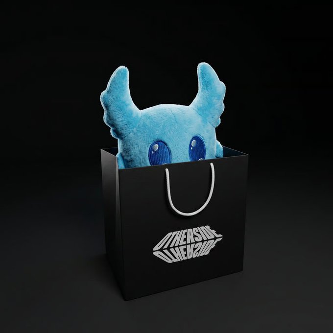 A plush blue toy resembling a character peeking out of a black shopping bag branded with the 'OTHER SIDE OLIVE 2025' logo.