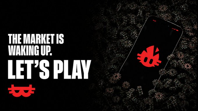 A promotional graphic features the text 'THE MARKET IS WAKING UP. LET'S PLAY' alongside a smartphone displaying a red cat logo, with a red mask logo below.