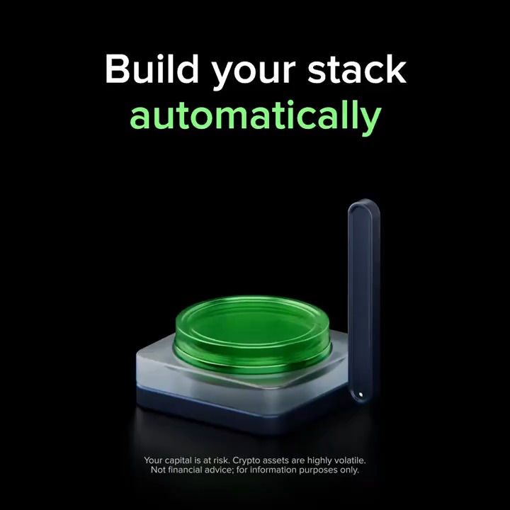 The image features a dark background with the headline "Build your stack automatically" in white and green text, alongside a 3D rendering of a glowing green button next to a dark smartphone. A disclaimer at the bottom reads, "Your capital is at risk. Crypto assets are highly volatile. Not financial advice; for information purposes only." The visual reinforces the message about Uphold's Repeat Transactions feature, symbolizing the ease of automating crypto purchases through a simple tap.