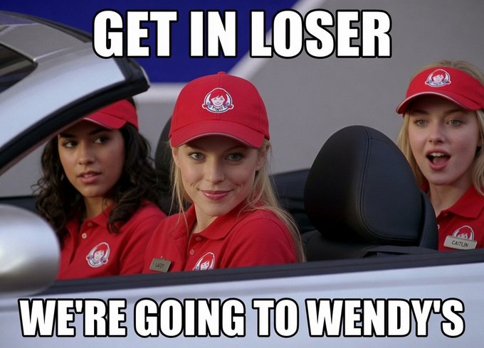 The image features three women wearing red hats, likely representing a fast food restaurant or a promotional event for a fast food chain like Wendy's. They are sitting inside a car with their heads sticking out of the window. The caption at the bottom of the image reads "$WEN". This suggests that they might be promoting a special offer or an event related to the fast food chain, such as a limited-time menu item or a special deal for customers who visit the restaurant.