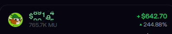 A financial widget shows a green character icon next to the figure "765.7K MU" with a gain of +$642.70 (244.88%).