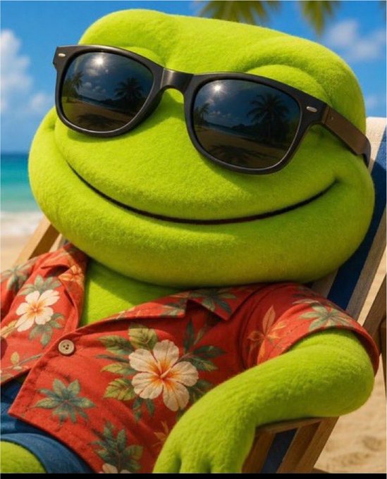 An AI-generated or 3D-rendered image of a green plush frog character wearing black sunglasses reflecting palm trees, dressed in a red Hawaiian floral shirt, lounging on a beach chair with a tropical ocean background.