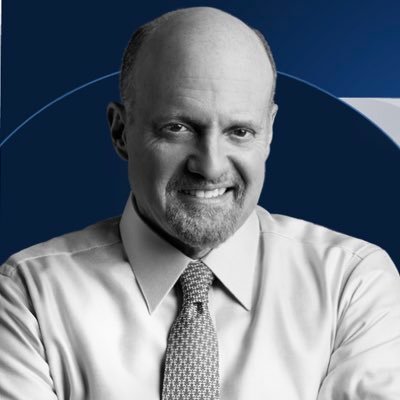 The black-and-white portrait features a smiling, bald man with a goatee wearing a white dress shirt and patterned tie, set against a navy blue background. The image relates to the post by depicting Jim Cramer, the financial commentator known for his investment advice on CNBC's "Mad Money," who is shown in his characteristic professional appearance as he recommends buying Bitcoin.