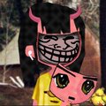 Small pixel art image featuring a pink devil-like character with horns and a wide grin, with a sleeping kitten below in a yellow blanket.