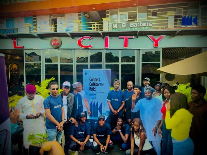 A group of people pose together at the "LCITY" venue during the official launch of Abuja Web3 Connect, with a banner reading "Connect. Collaborate. Build." displayed behind them, matching the event mentioned in the post.