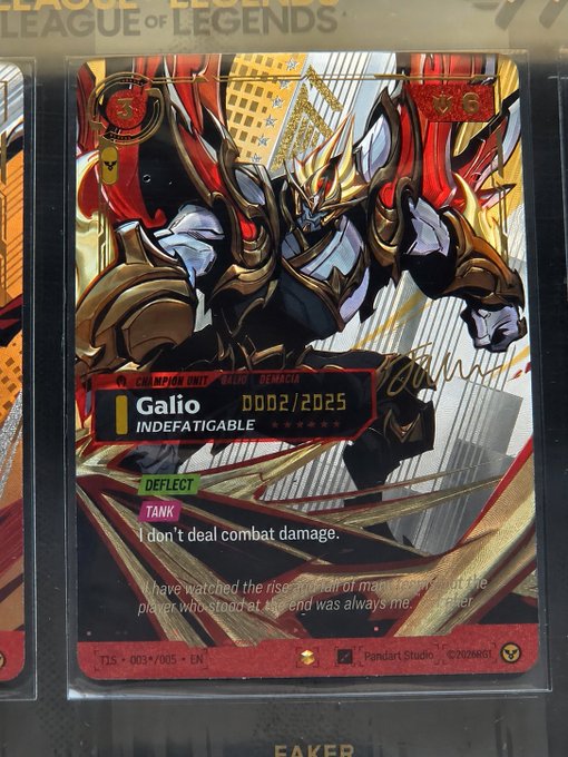A limited-edition Riftbound League of Legends trading card featuring the champion Galio with Faker's signature, numbered 0002/2025 in the Championship Unit "Gemacia" series, is displayed in a protective sleeve alongside other cards. The post celebrates pulling this highly rare signature card and questions whether T1 boxes will drive up card values, with the buyer reportedly seeking $150,000.
