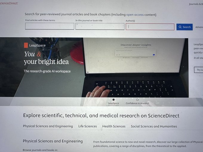 Screenshot of the ScienceDirect homepage showing a search bar for peer-reviewed journal articles and book chapters, with a promotional banner for LeapSpace AI workspace.