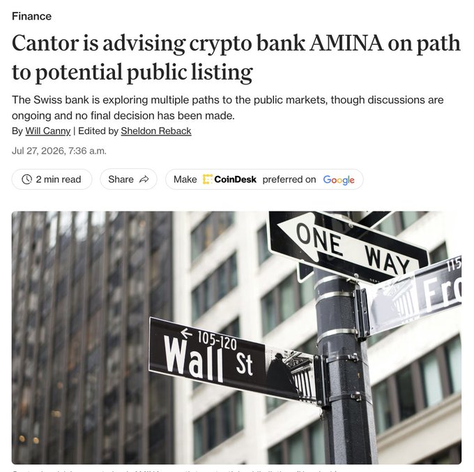 A CoinDesk article headlined "Cantor is advising crypto bank AMINA on path to potential public listing" is displayed above a black-and-white photo of a Wall Street signpost featuring a "Wall St" sign and a "ONE WAY" sign, visually tying the crypto bank's potential Wall Street IPO to the iconic financial district.