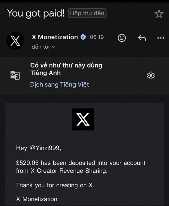 A screenshot of an X (Twitter) notification in Vietnamese showing a payment of $520.05 deposited into the account of user @Yinzi999 from X Creator Revenue Sharing.