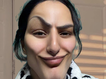 A digitally altered, surreal image of a person's face with exaggerated features—elongated nose, stretched smile, and oddly shaped eyebrows—wearing a striped shirt.