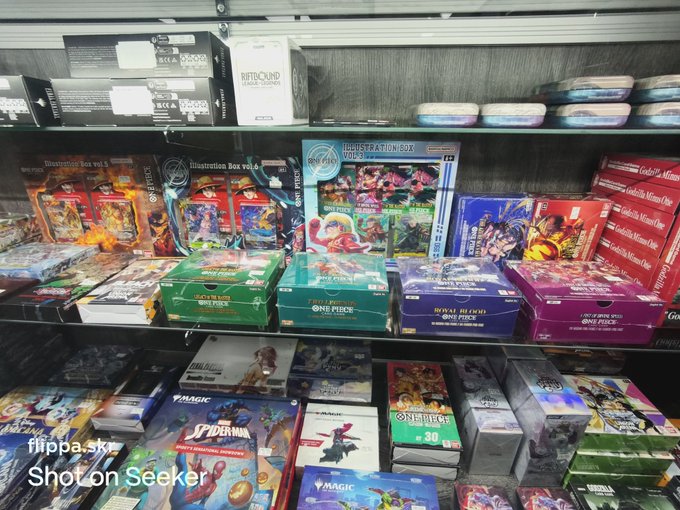 The image shows a shelf filled with various video game cases, including action figures and board games. There are at least 13 different types of games displayed, ranging from classic titles like "Super Mario Bros." to more recent releases such as "Minecraft" or "Fortnite". The assortment of games suggests that the store offers a wide range of gaming options for customers to choose from.

The post about OP boxes is related to this image because it appears that the store may be selling video game cases and accessories, which are often referred to as "OP boxes." These boxes typically contain additional items such as instruction manuals or extra game components like cards or dice. The presence of these boxes in the image indicates that the store offers a variety of gaming options for customers who prefer physical copies of games rather than digital versions.