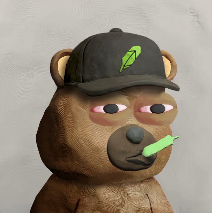 3D-rendered figure of a brown bear wearing a black cap with a green feather logo, featuring red-rimmed eyes and a green object in its mouth.