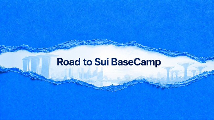 A blue graphic with a torn-paper effect in the center displaying the text 'Road to Sui BaseCamp' over a cityscape silhouette.