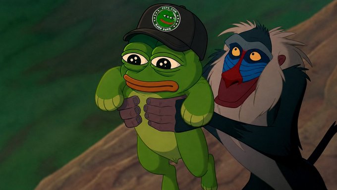 An animated scene from The Lion King shows Rafiki the mandrill holding baby Simba, who is wearing a black baseball cap with a Pepe the Frog logo.