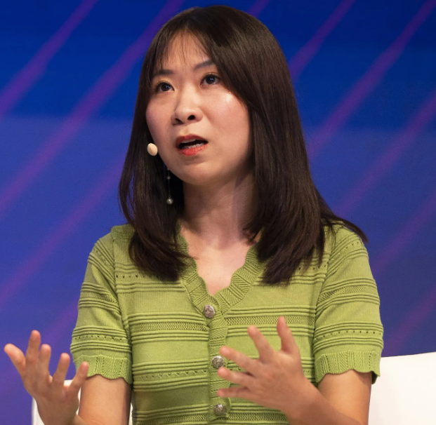 Constance Wang speaking at a conference.
