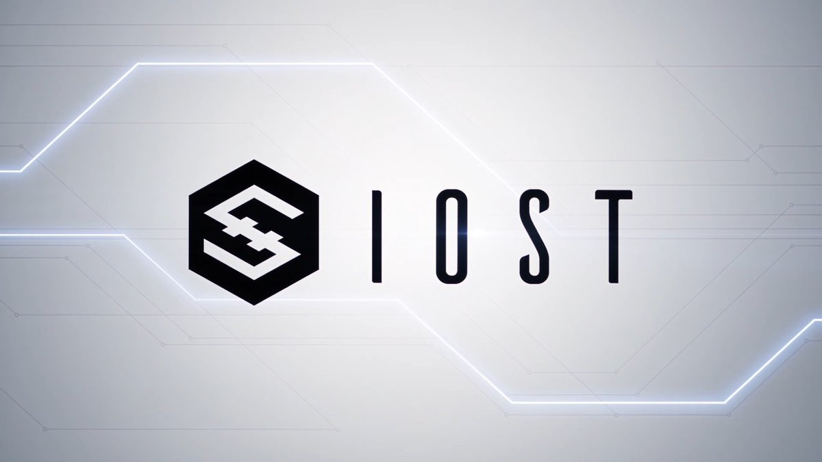 The IOST logo and ticker are displayed on a sleek gray background with illuminated geometric lines, promoting the cryptocurrency's appearance at The Bridge Summit alongside co-CEO Blake.