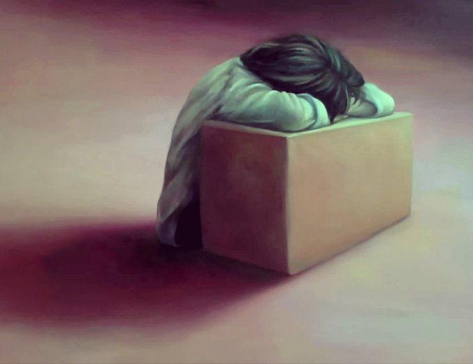 A painting of a person with long dark hair slumped forward with their head resting on their arms on top of a plain rectangular box against a muted, reddish background.
