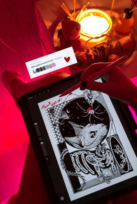 A person using a stylus on a tablet to create black and white digital artwork with the text 'Thank You,' illuminated by warm ambient lighting and a recent message from @DogofDoomsday.eth.