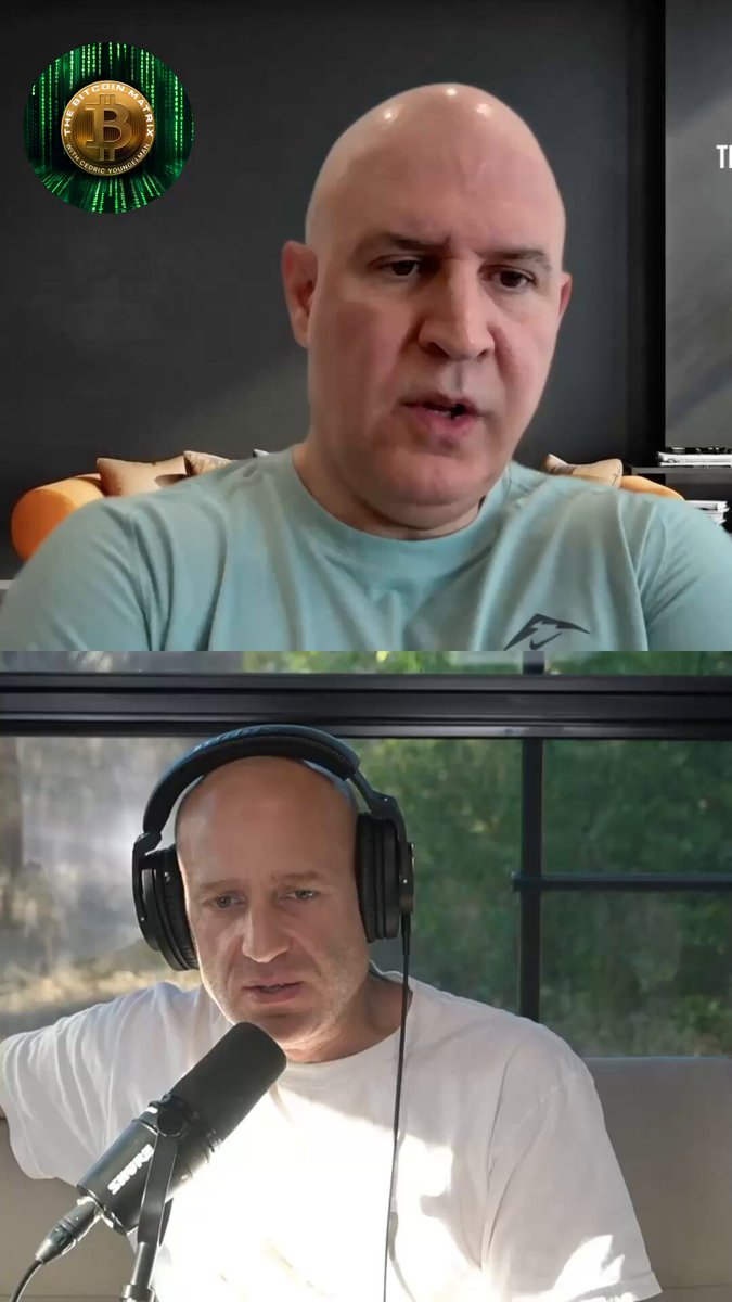 The image shows two men wearing headphones sitting at a table with microphones. One man has a microphone close to his ear while the other one has a microphone further away from him, both of them wearing white t-shirts. The background features a clock on the wall and an orange chair in front of it. The post includes text that reads "Tired of being ripped off? Lied to? Funding the evil in the world? Always asking permission, always under someone else' thumb?". This suggests that Bitcoin might be related to the content of the image or could be a topic of discussion on social media platforms.