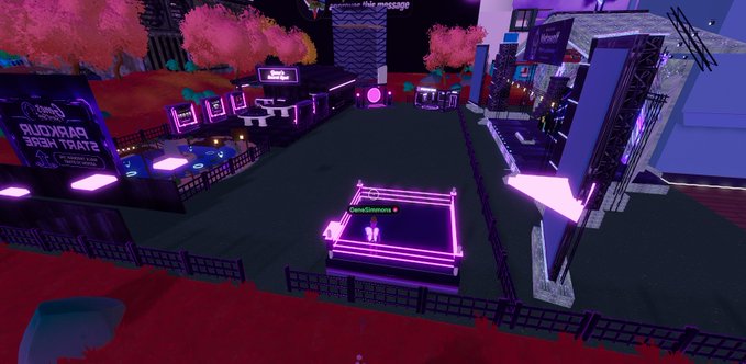 A screenshot from a Roblox game showing a neon-lit virtual plaza with a stage, arcade cabinets, and a sign reading 'RUDXRPG ROOM THATS'.