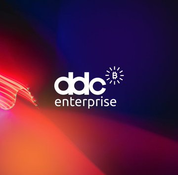The image features a logo for a company called "ddc Enterprise" that specializes in buying Bitcoins. The logo consists of a white "DDC" lettering with an arrow pointing towards a red "E" below it, creating a sense of movement or direction. Below this, there is a small white "E" representing the word " Enterprise". In addition to these elements, there are two lines of text that read "ddc Enterprise" and "Bitcoin 100 Ranking: 28", providing information about the company's focus on Bitcoin trading and its ranking in the Bitcoin market.