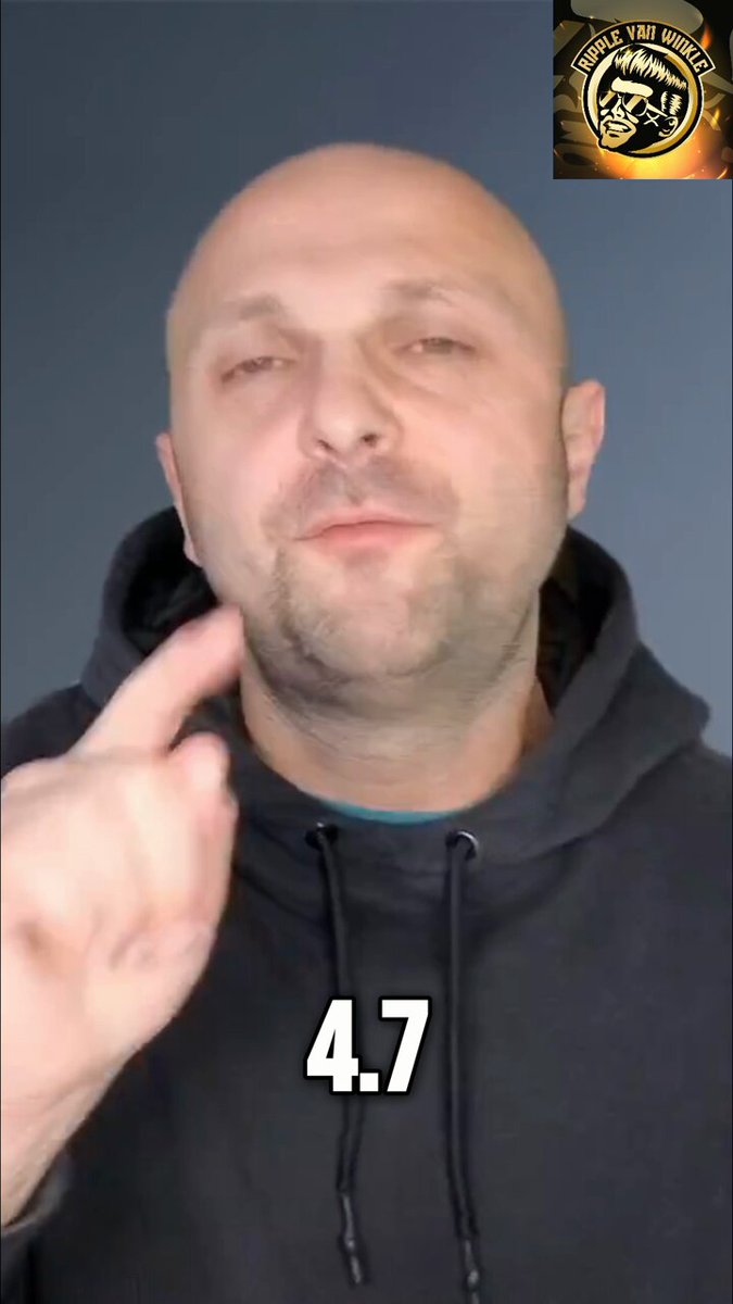 The image features a bald man wearing a hoodie, with his fingers pointing outward as if he's making a peace sign. In the background, there is text that reads "Ripple Prime just got a seat inside their tokenization working group. $114 Trillion moves next. Nobody is talking about this." The man and the post are the main focus of the image, while the text behind him provides context to the situation.
