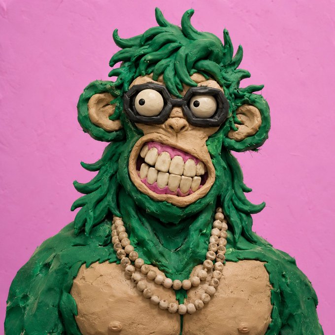 The image features a green monkey sculpture with a pink background, wearing glasses and a necklace. The monkey has a big smile and appears to be posing for the camera. The caption reads "gm gm me trying to understand the market after checking my portfolio for 30 seconds...", which suggests that someone might have created this unique sculpture as an art piece or for promotional purposes.

The monkey is wearing glasses, which adds to its quirky appearance. Additionally, there are beads on the monkey's neck and chest area, further enhancing the whimsical nature of the sculpture. The pink background provides a vibrant contrast to the green monkey, making it stand out even more.