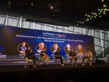A panel discussion titled 'Stablecoins in the Real World: Payments, Payroll and Cross Border Settlement' at 'CoinForum', with multiple speakers seated on stage and the date '5-6 Oct 2023' visible.