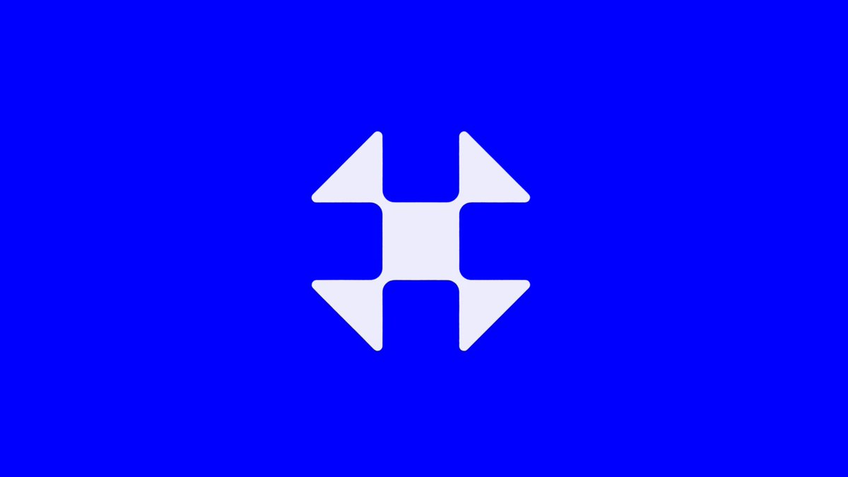 The image features a blue flag with white arrows pointing upwards. The arrows are positioned at the center of the flag, creating a sense of balance and symmetry. The background color of the flag is blue, which complements the white arrows perfectly. The overall design of the flag appears to be simple yet visually appealing.