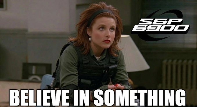 A meme featuring a red-haired woman in a tactical vest with the 'SEP 6500' logo and bold text reading 'BELIEVE IN SOMETHING'.