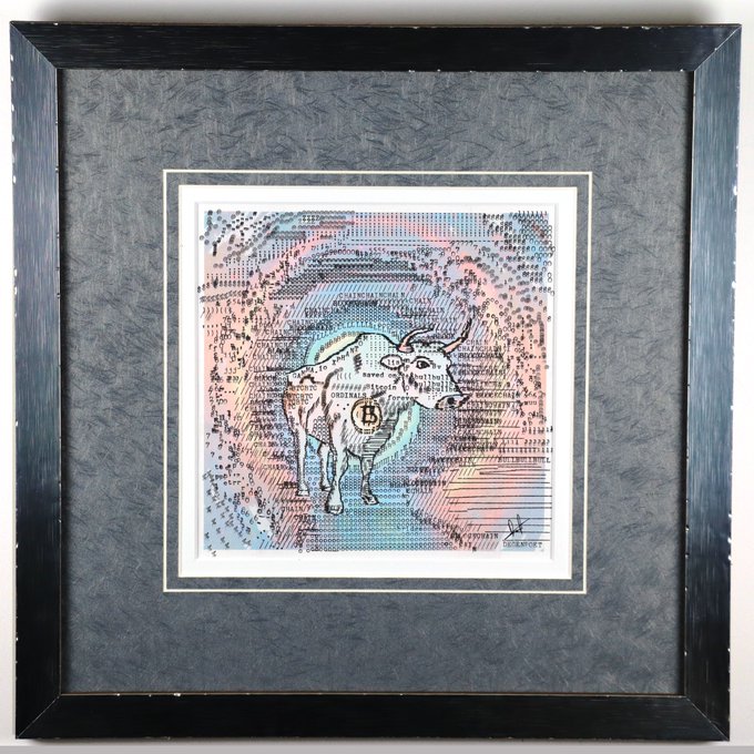 Framed artwork of a bull overlaid on what appears to be stock or financial document paper, with a Bitcoin 'B' logo on its body, mounted in a black frame with a gray matte.