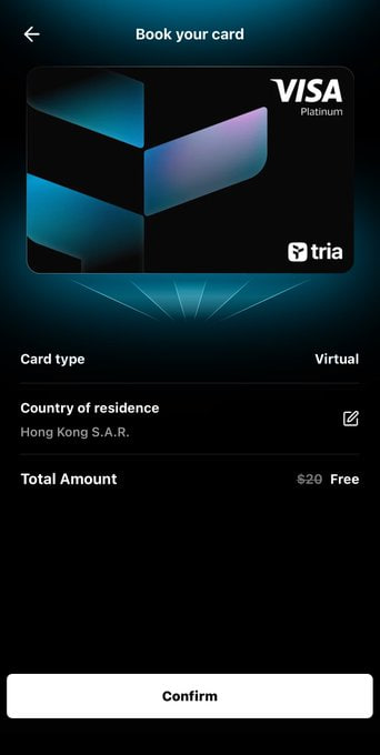 A screenshot of the Tria app showing the "Book your card" page for a Visa Platinum Virtual card, with country of residence set to Hong Kong S.A.R., a total amount of $20 marked as Free, and a Confirm button at the bottom. The image illustrates the setup process for the Tria virtual card referenced in the post, highlighting its features like 10% cashback, free issuance, and compatibility with multiple payment platforms.