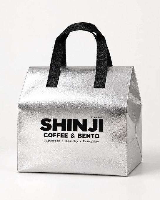 A shiny silver insulated bag with black handles and the text 'SHINJI COFFEE & BENTO', 'Since 2023', and 'Japanese • Healthy • Everyday'.