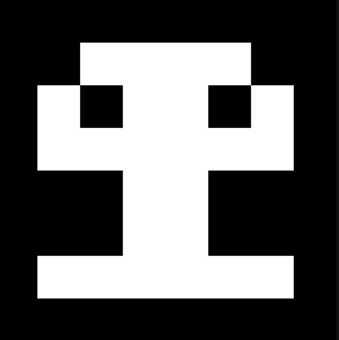 A black and white pixelated image depicting a stylized, blocky face or skull with two square eye sockets on a black background.